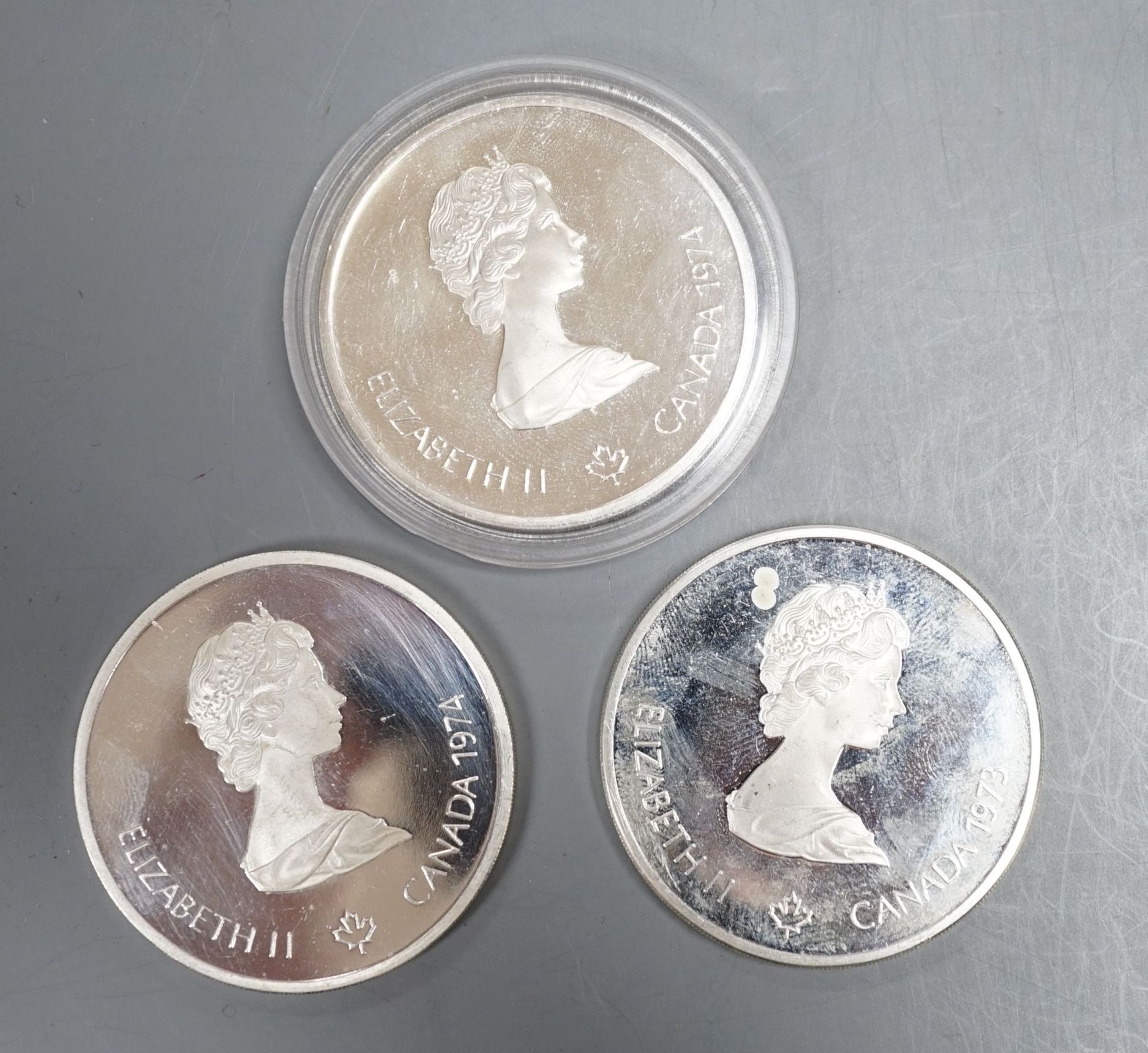 Three Canadian $10 silver Olympic Coin, Montreal 1976 Games total weight 145.2 grams.